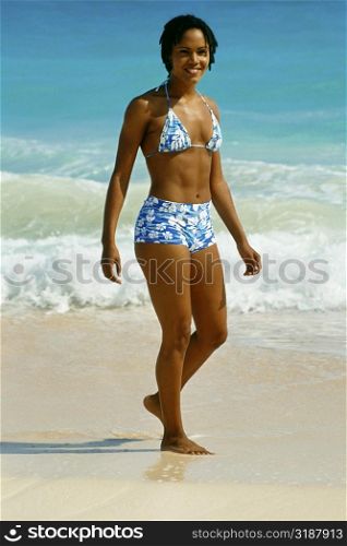 Woman in bikini, Natural Arches Beach, Bermuda