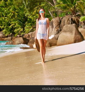 Woman in bikini on beach Anse Intendance at Seychelles, Mahe