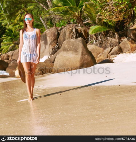 Woman in bikini on beach Anse Intendance at Seychelles, Mahe