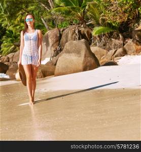 Woman in bikini on beach Anse Intendance at Seychelles, Mahe