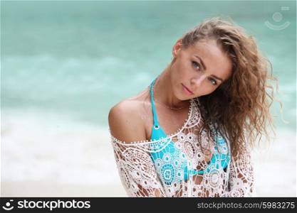 Woman in bikini on beach. Beautiful woman in bikini posing on beach