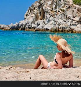 Woman in bikini on beach, Sithonia, Greece