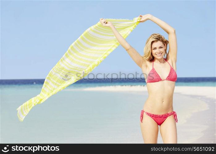 Woman In Bikini On Beautiful Tropical Beach Holding Sarong