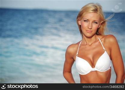 woman in bikini on sea background