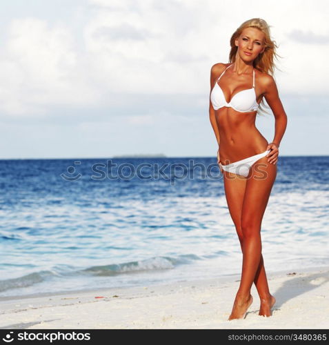 woman in bikini on sea background