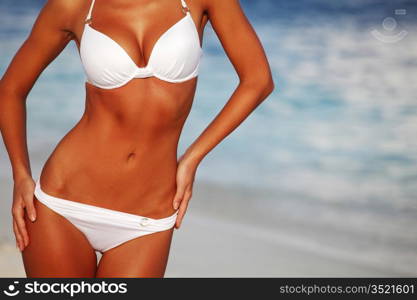 woman in bikini on sea background