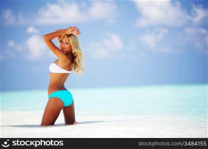 woman in bikini on sea beach