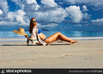 Woman in bikini on tropical beach at Seychelles
