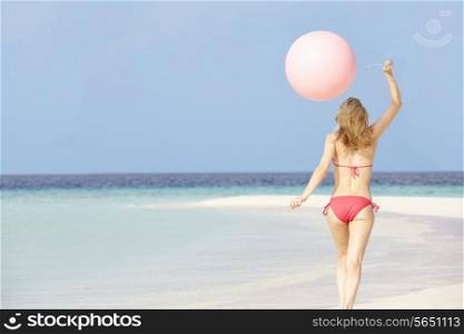 Woman In Bikini Running On Beautiful Beach With Balloon