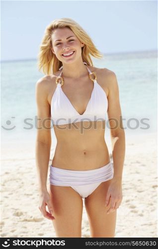 Woman In Bikini Standing On Beautiful Tropical Beach