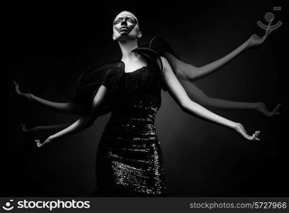 woman in black dress moving hands