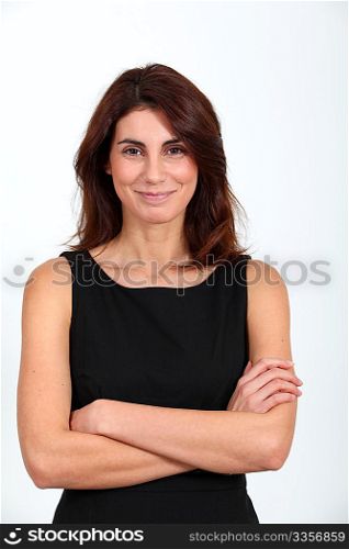 Woman in black dress with arms crossed