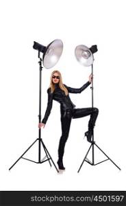 Woman in black leather dress in studio shootout