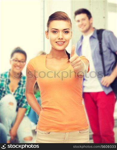 woman in blank t-shirt showing thumbs up at school