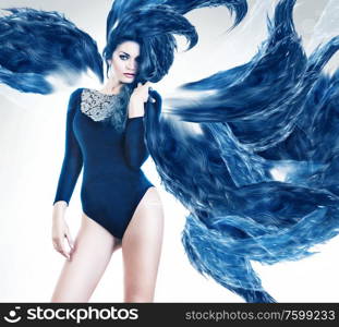 woman in blue abstract hair around