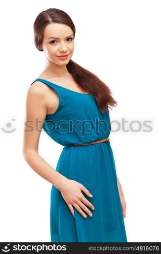 Woman in blue dress. Beautiful young brunette woman in blue dress