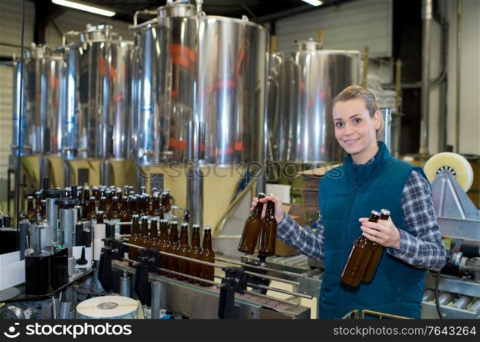 woman in brewery bottling plant