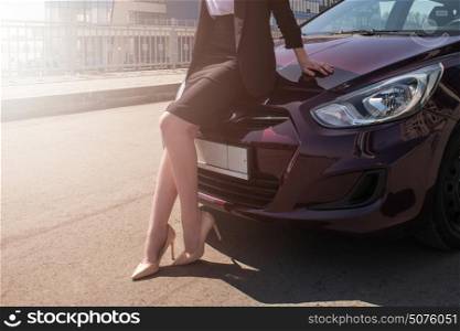 Woman in business suit in a car. Woman in a car