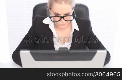 Woman in Business Suit with Laptop