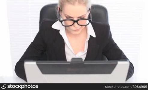 Woman in Business Suit with Laptop