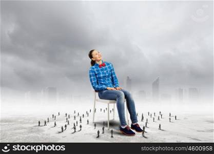 Woman in chair. Woman in casual sitting on chair and small silhouettes of businesspeople around