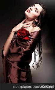 woman in chocolate drapery with red rose