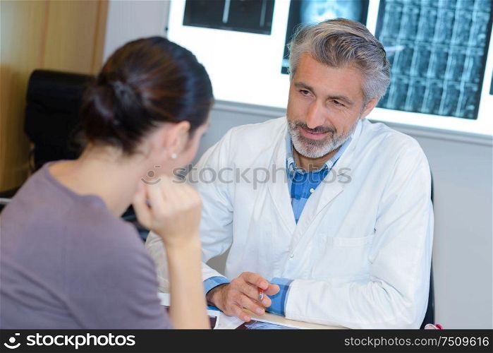 Woman in consultation with doctor