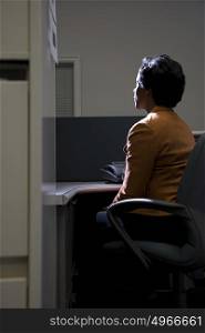 Woman in dark office