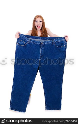 Woman in dieting concept with big jeans