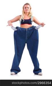 Woman in dieting concept with big jeans