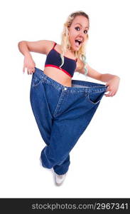 Woman in dieting concept with big jeans