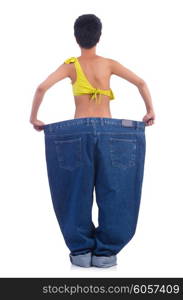 Woman in dieting concept with big jeans