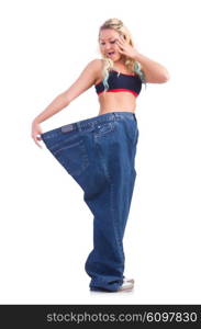 Woman in dieting concept with big jeans