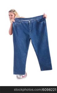 Woman in dieting concept with big jeans