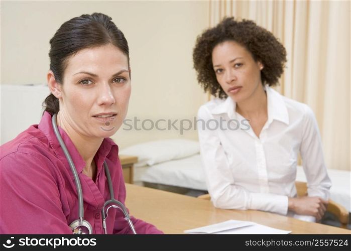 Woman in doctor&acute;s office frowning