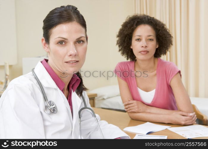 Woman in doctor&acute;s office frowning