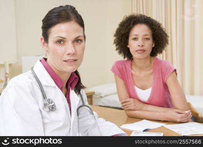 Woman in doctor&acute;s office frowning