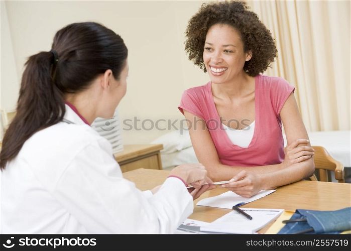 Woman in doctor&acute;s office smiling