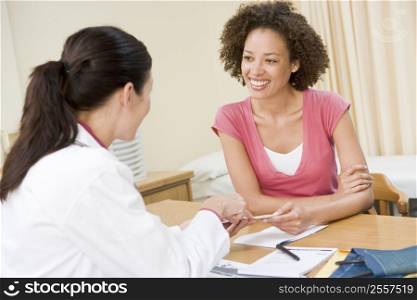 Woman in doctor&acute;s office smiling