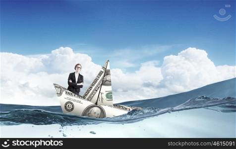 Woman in dollar boat. Businesswoman escapes from crisis on paper boat made of dollar banknote