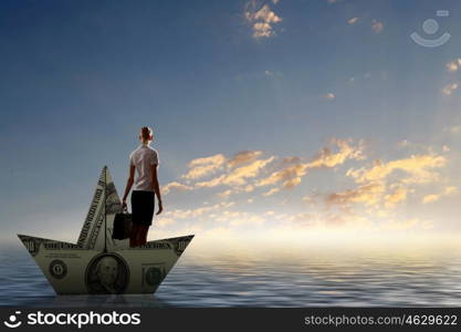 Woman in dollar boat. Businesswoman escapes from crisis on paper boat made of dollar banknote