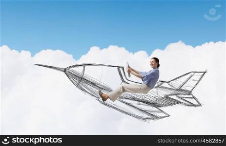 Woman in drawn airplane. Funny image of woman flying in drawn airplane