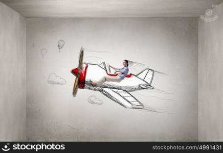 Woman in drawn airplane. Funny image of woman flying in drawn airplane