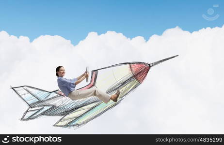 Woman in drawn airplane. Young funny woman flying in air in drawn airplane