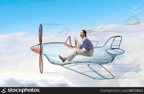 Woman in drawn airplane. Young funny woman flying in air in drawn airplane