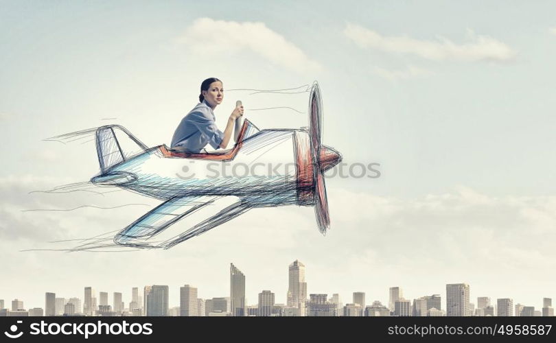 Woman in drawn airplane. Young funny woman flying in air in drawn airplane