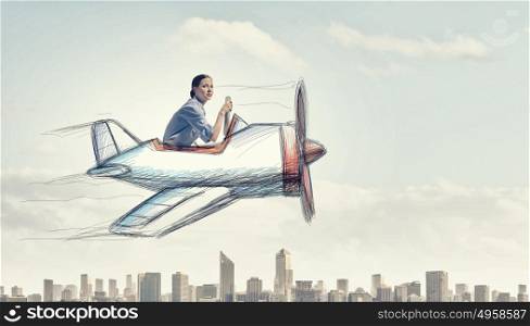 Woman in drawn airplane. Young funny woman flying in air in drawn airplane