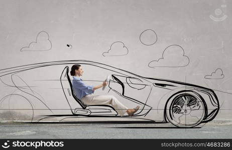 Woman in drawn car. Young humorous woman driving drawn funny car