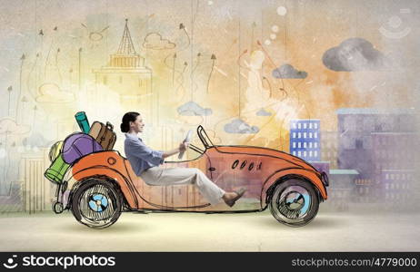 Woman in drawn car. Young humorous woman driving drawn funny car