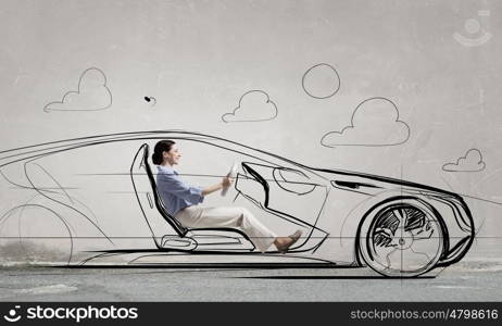 Woman in drawn car. Young humorous woman driving drawn funny car